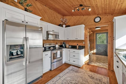Fully stocked kitchen with stainless steel appliances and everything you`ll need to make a home cooked meal