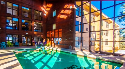 Solarium pool/Jacuzzi with adjacent fitness center