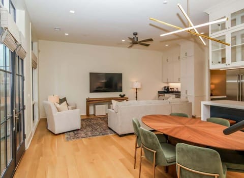 Intimate living space detail highlighting the contemporary decor and natural light from large French doors.