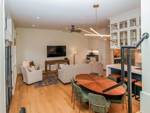 View of the expansive main floor showcasing the high ceilings and the scale of the living and dining zones.