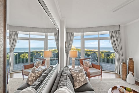 Enjoy scenic coastal views, cozy seating, and a wall-mounted TV for relaxation.