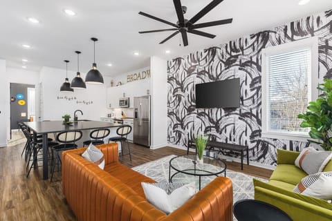 Spacious kitchen & living areas with a Smart TV, comfortable furnishings, and plenty of seating for your group to kick back after exploring the city.