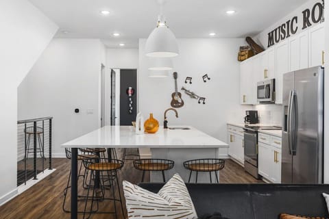 Massive kitchen on the main level with a coffee machine, wine cooler, and all the other kitchen essentials you'll need to cook & make yourself at home.