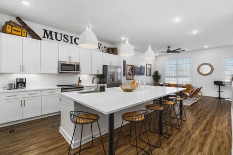 Massive kitchen island with seating for 8. We provide all the kitchen essentials, cleaning supplies, and utensils so you can cook & make yourself at home.