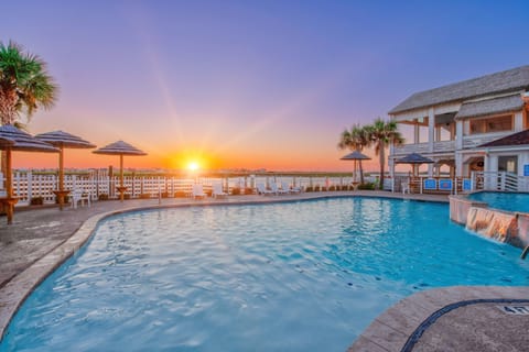 Stunning sunset views over the sparkling pool create the perfect backdrop for your evening relaxation.