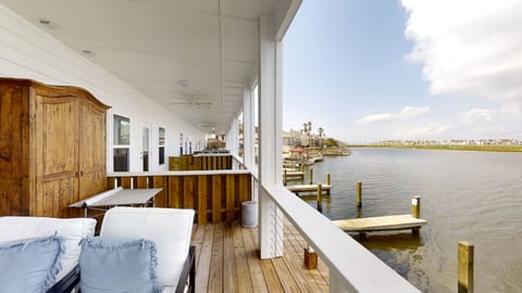 Sip your morning coffee on this waterfront deck while watching boats glide by your private dock.
