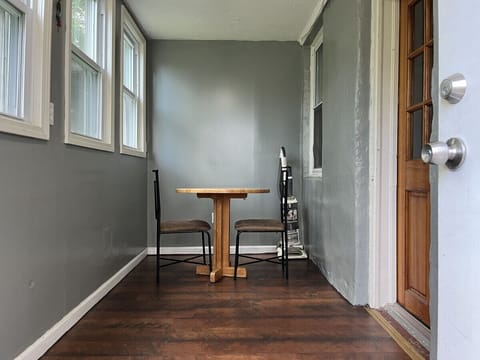 Enclosed porch to enter the kitchen.  Enjoy your coffee and breakfast in this peaceful atmosphere.