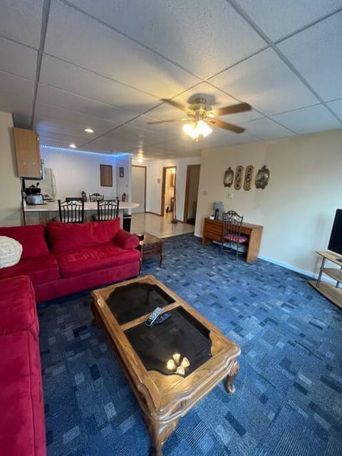 Relax, wind down, watch a movie or finish up the work day in this comfortable living area with a large TV and desk to meet your needs.