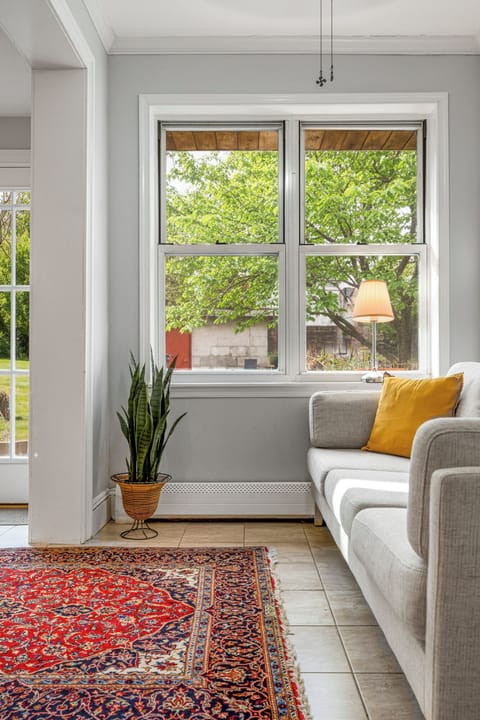 Enjoy sipping on a cup of coffee in the sunroom while watching squirrels play