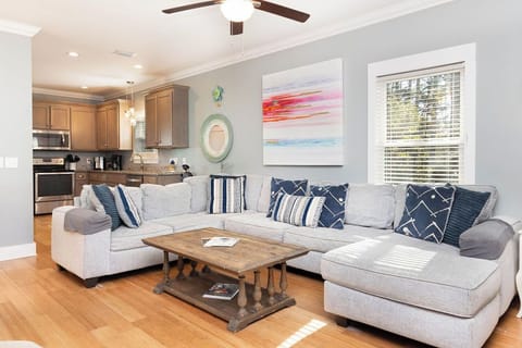 Living Area - Enjoy your down time relaxing on the cozy, sectional sofa in the spacious living area.