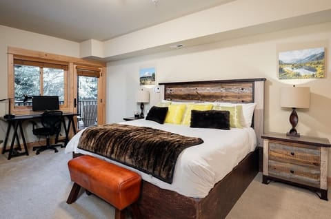 Master bedroom with a King-size bed and private door to deck