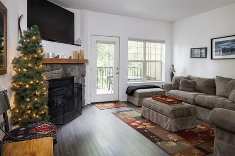 Flat screen TV and gas fireplace in the living room area