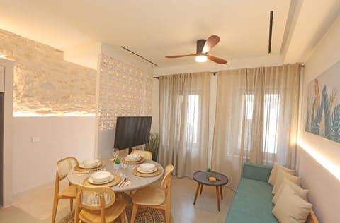 Living room with dining area, tv, ceiling fan