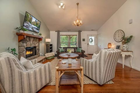 Main living area complete with comfortable chairs, fireplace, and TV! 

