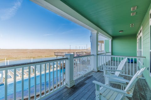 Relax in your private waterfront chairs while enjoying endless ocean views from your covered balcony.