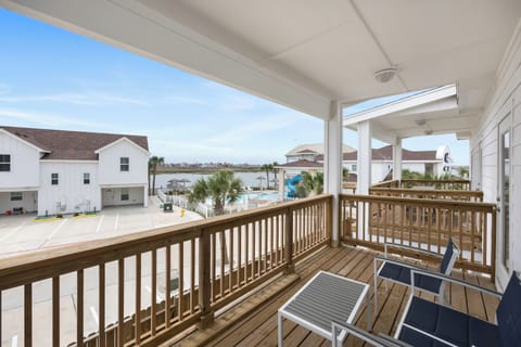 Relax on your private covered balcony with coastal views, complete with comfortable seating to enjoy morning coffee or evening sunsets.