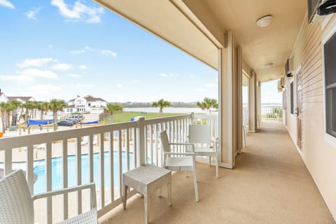 Unwind on your private balcony with poolside views and coastal breezes, perfect for morning coffee or evening relaxation.