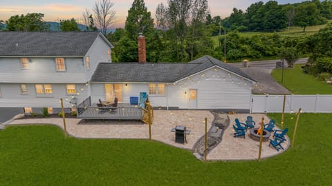Relax in this spacious retreat with a lit patio, cozy fire pit, and serene views