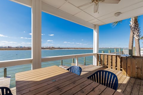 Dine with stunning waterfront views from your private covered deck, where morning coffee and sunset dinners become unforgettable moments.