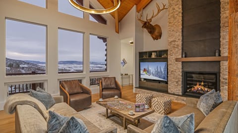 Great Room, Main Level - Seating area with fireplace, TV, and views