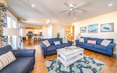 Coastal-inspired living room with cozy seating and fireplace