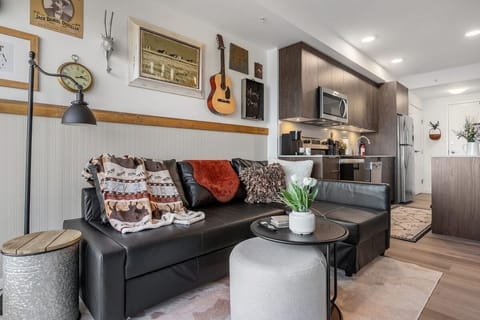 High-Rise Saloon Luxury: Elevate your stay with the Old West spirit and panoramic city vistas at this Bridgeland condo.