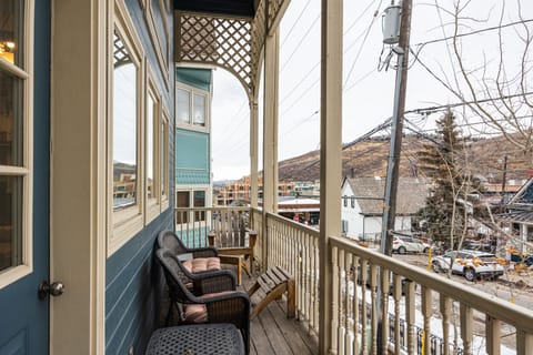 - Sip coffee or wine from a private porch with views of charming downtown rooftops
- Adirondack and wicker chairs offer cozy spots to take in the mountain scenery
- Enjoy a true alpine atmosphere just steps from the heart of town