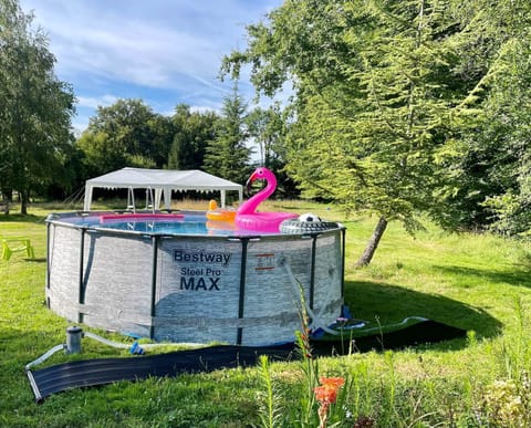 5m heated pool in the extensive gardens