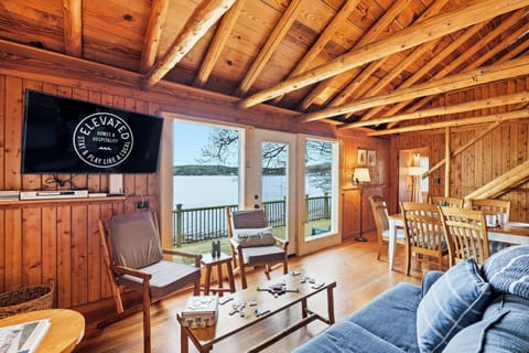 Lake days and domino plays! Cozy up in this beautiful wooden cabin with unbeatable water views.
