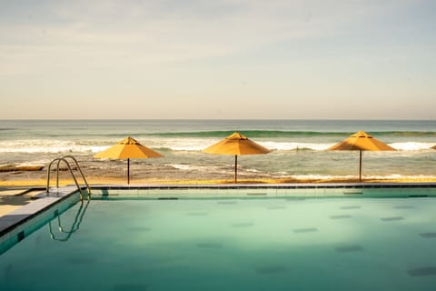 15 outdoor pools, open 9:00 AM to 10:00 PM, pool umbrellas, sun loungers