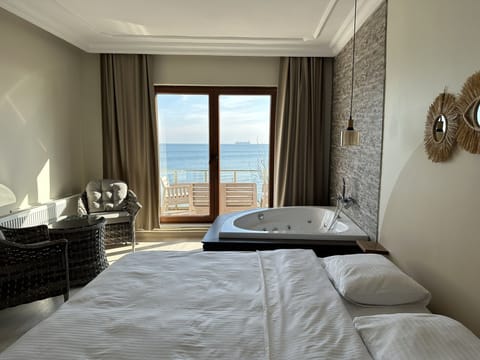 Deluxe Room, 1 King Bed, Terrace, Sea View | Minibar, WiFi (free), bed sheets