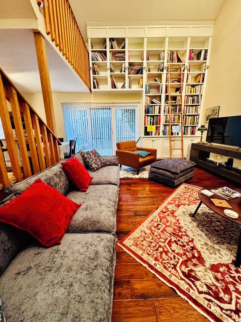 Enjoy the comfort of a cozy sofa, a great selection of books and natural light.