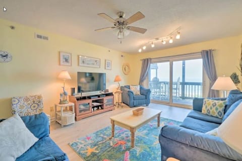 Spacious living area with ocean views and 50 inch Roku smart TV.