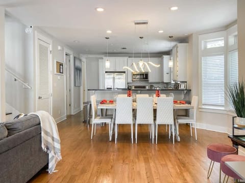 When you walk through the front doors, you’ll enter the kitchen, living and dining areas.