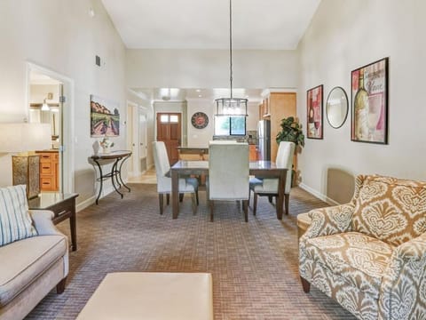 Living room and dining area with high ceilings that open the space