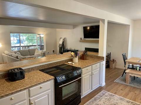 Kitchen with bar and bar stools
