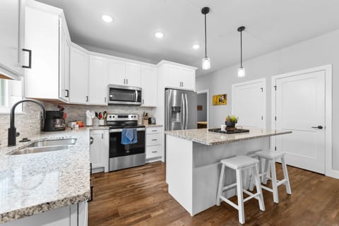 Full Kitchen with Major Appliances & Bar Seating