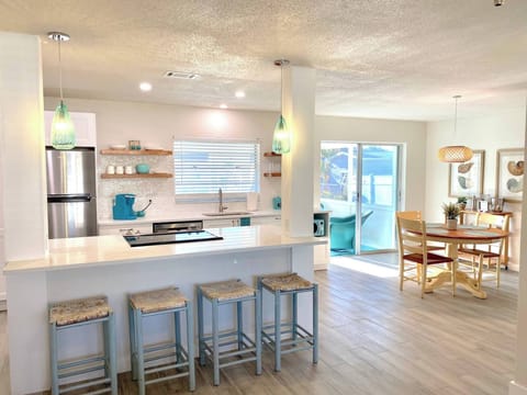 There is room for your entire party to sit and eat, play games or enjoy each other's company. Someone should bake cookies and fill the whole room with sugary smells! Can't you see the stools of people waiting for a hot one out of the oven?