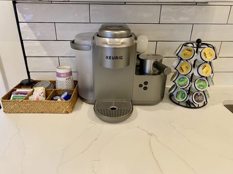 Keurig coffee machine. We supply coffee pods, cream, and sugar.