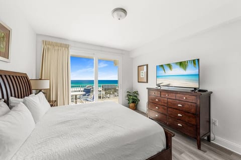 Spacious master bedroom with a king-size bed, private access to the balcony, and an en-suite master bathroom for comfort