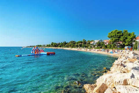 Room, 1 Bedroom, Balcony, Garden View | Beach