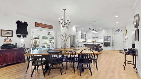 Open concept kitchen & dining area with seating for 12