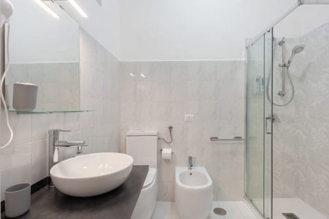 Suite Family | Bathroom | Rainfall showerhead, hair dryer, bathrobes, bidet