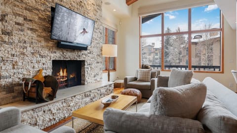 Great Room, Main Level - Seating area with fireplace and TV