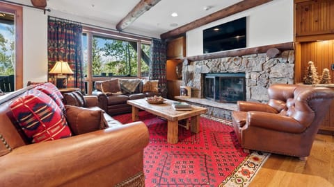 Great Room, Main Level - Seating area with fireplace and TV