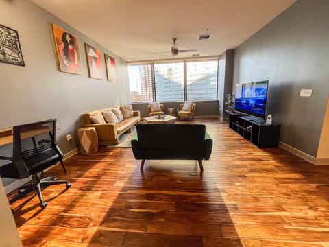 Living Room with City View
Relax and enjoy stunning city skyline views.