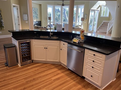 Kitchen featuring stainless steel Kitchenaid DW, Thor ice maker & wine fridge