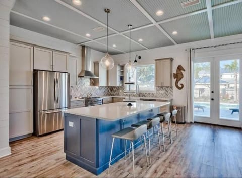 Beautiful custom kitchen with chefs stainless gas stove and appliances.