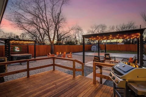 Fire up the grill & enjoy a backyard built for fun! Whether you're cooking up a feast, soaking in the hot tub, competing in pickleball, or gathering around the fire, this outdoor space is designed for memorable evenings under the string-lit sky!
