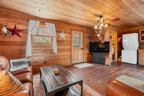 Rustic cabin living room with wood paneling, a cozy and inviting space